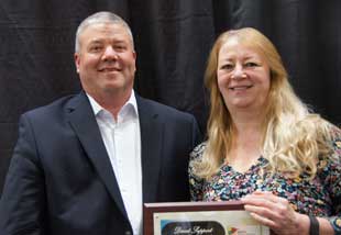 MOHR President Mike Burke, left, presents a Direct Support Professional Award to Rita Cassens, who has worked as a substitute at Mille Lacs County DAC for 21 years.